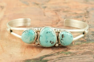 Genuine Blue Moon Turquoise set in Sterling Silver Bracelet. The Blue Moon Turquoise Mine is located in Esmeralda County, Nevada. It closed in the late 1970's. Blue Moon Turquoise is now obtained from private collections. Created by Navajo Artist Milton Lee. Signed by the artist.